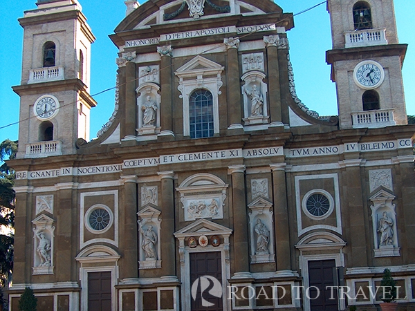 Frascati - Cathedral View of the facade of Frascati Cathedral. Dedicated to St Peter the Apostole it is one of the finest<br/>examples of Baroque churches of Rome area. Frascati has always been famous for Italians to<br/> produce an excellent Frascati DOC white wine and for its historical cellars, where once it was <br/>common to go and buy the fresh wine tapped directly from the barrels. Today the wineries have<br/>become nice small restaurants thet offer local specialties accompanied by a carafe of fresh wine <br/>tapped from the barrel.