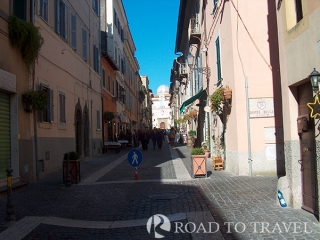 Castel Gangolfo - Rome The visit of Castel Gandolfo, located about 15 miles from Rome, is one of most popular day tour from<br/>Rome. This little village build on the top edges of the Lake Albano, is considered one of the nicer <br/>village of Italy. Its popularity comes from the Palazzo Pontificio and its gardens, one of Pope <br/>residence outside Rome. From the balcony ovelooking the Church of St Thomas and the fountain of <br/>Bernini the Pope usually recites the Sunday Angelus with Papal Blessing during the Summer season.