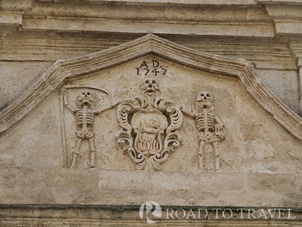 Matera - Purgatorio Church Skeleton decor on the facade of the Purgatorio Church.