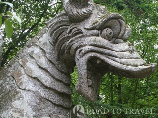 Dragon with Lions - Parco dei Mostri The Dragon attacked by Lions is one of the main sculpure inside the Bomarzo Gardens.