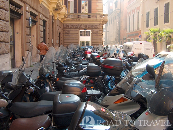 Scooters - Rome A parking lot of scooters in Rome, Italy. Driving a scooter is one of the most common methods of transport by Romans. This is also one of the funniest things to see, where scooters of all sizes, brands and colors are driven madly. It is estimated that the scooter population is over 3 million.